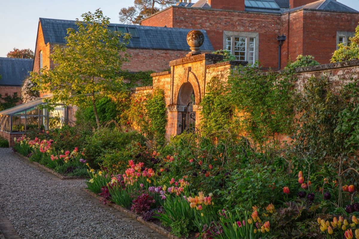 The house at Morton Hall, Worcestershire, over a summer border